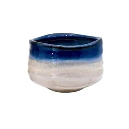 Blue and white Japanese chawan tea bowl on a wooden table