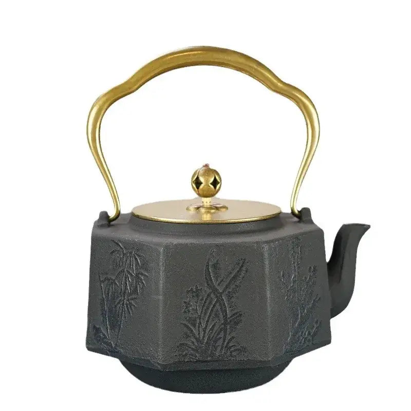 Handcrafted Japanese tetsubin teapot with lid on natural wood surface