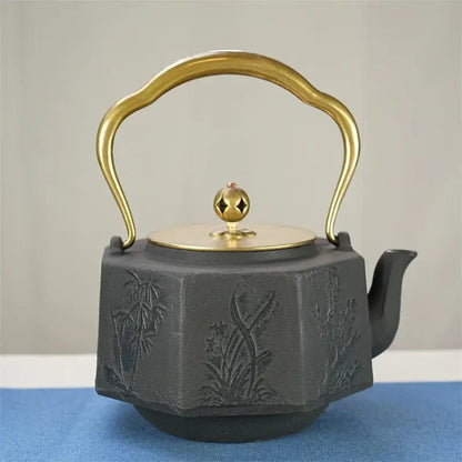 Close-up of cast iron teapot spout and ergonomic handle detail