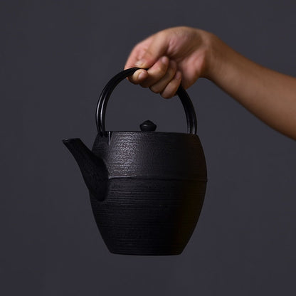 Japanese cast iron teapot in cozy hygge setting, steam rising