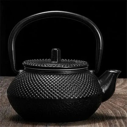 Japanese cast iron teapot 300ml with infuser on wooden surface
