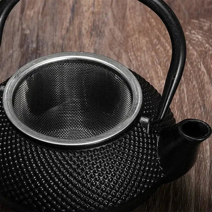 Hammered texture cast iron teapot 300ml, single cup size, side view