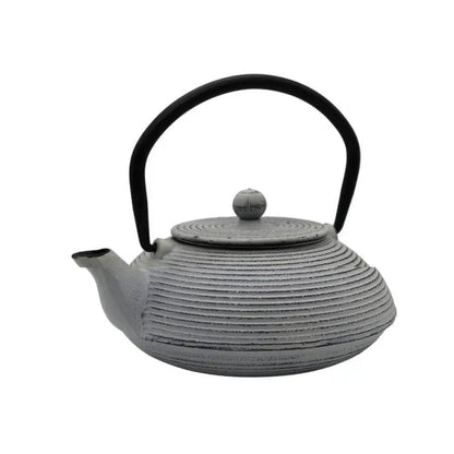 Japanese cast iron teapot pouring tea into cup