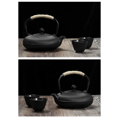 Cast iron teapot on stove with steam rising