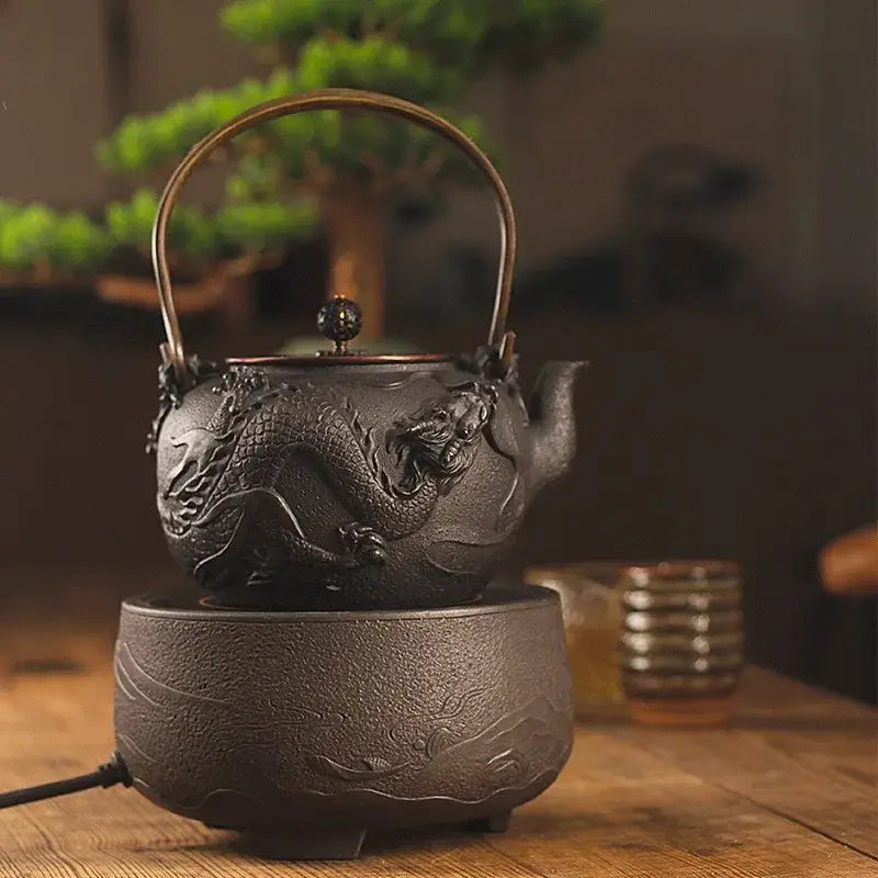 Japanese cast iron teapot dragon 1.2L on wooden table with loose leaf tea