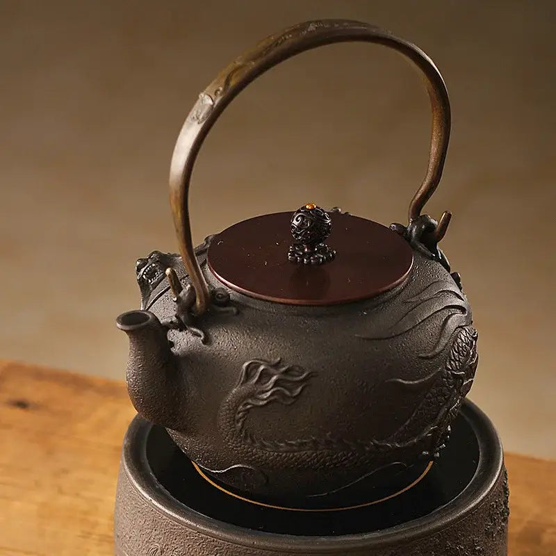 Cast iron teapot dragon 1.2L with lid open showing stainless steel infuser basket