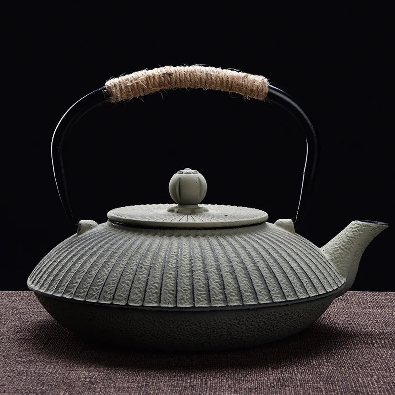 Japanese cast iron teapot flat tetsubin style in green with hammered surface texture