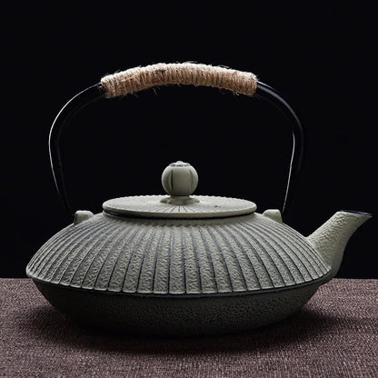 Japanese cast iron teapot flat tetsubin style in green with hammered surface texture