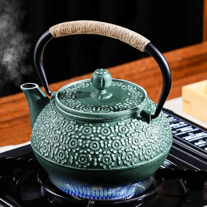 Cast iron teapot with loose leaf infuser, cherry blossom pattern, enamel-coated interior