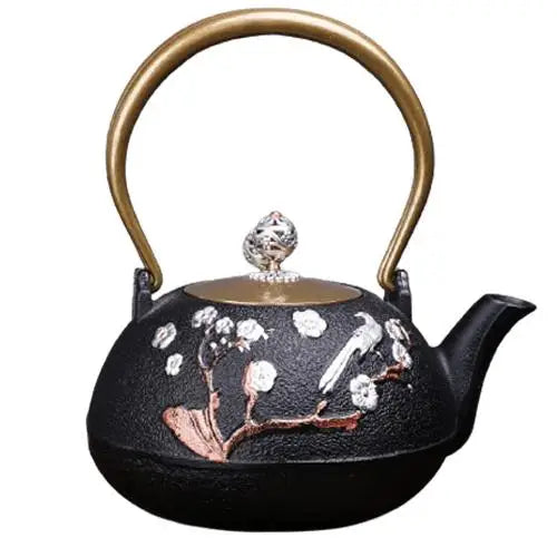 Cast iron teapot with cherry blossom design and lid