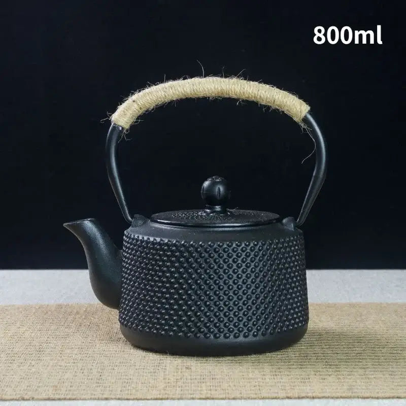 Enamel coated interior of cast iron teapot, close-up showing rust-proof glazed finish