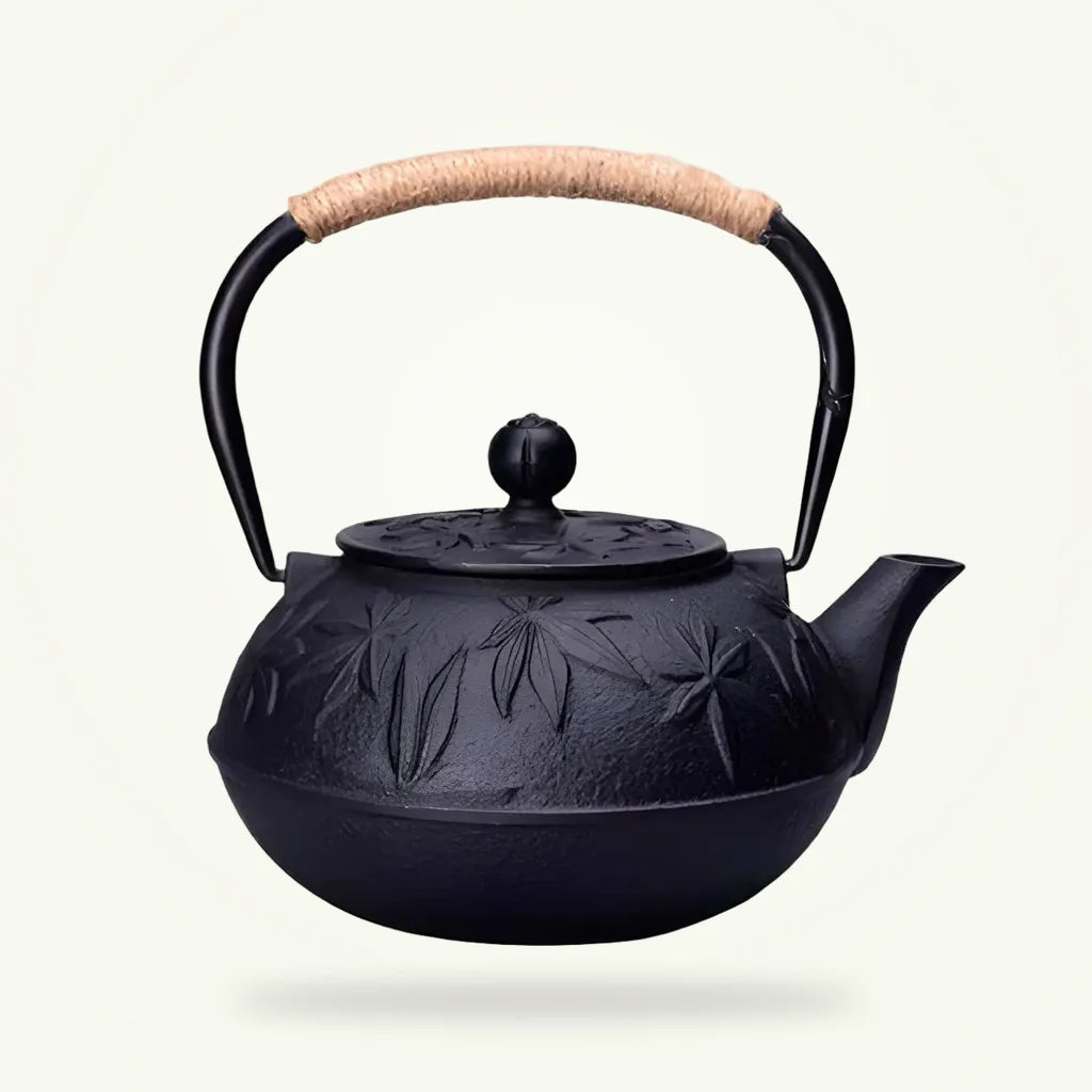 Japanese Cast Iron Teapot with Engraved Autumn Leaf Design, product photo on a plain background