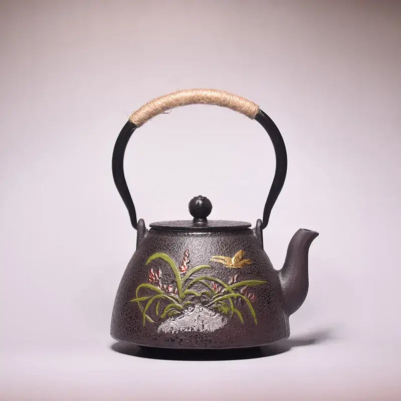 Cast iron teapot with flower motif, forged decor