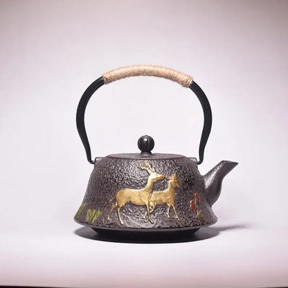 Cast iron teapot with deer motif, traditional design