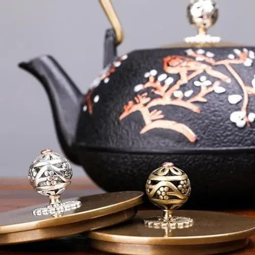 Cast iron teapot lid with sakura design