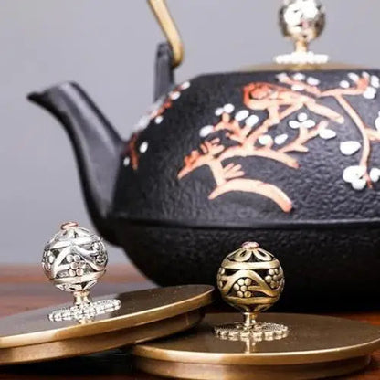 Cast iron teapot lid with sakura design