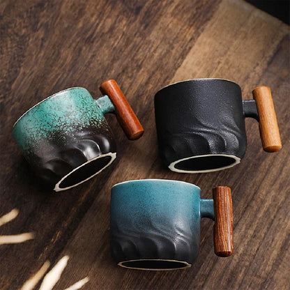 Black Japanese ceramic tea cup with wooden handle, front view