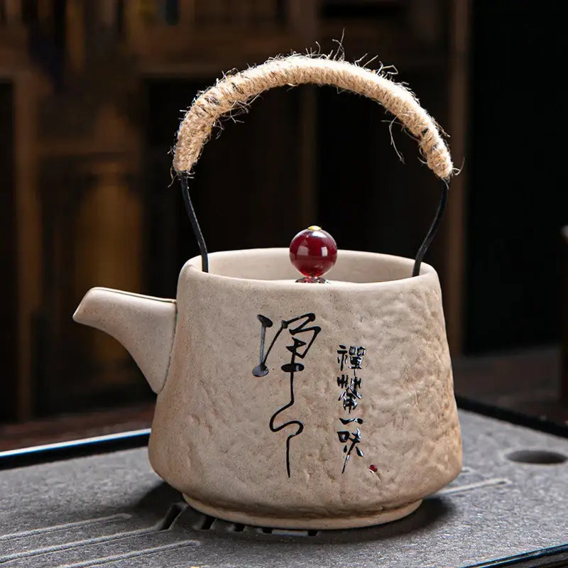 White ceramic teapot with Japanese writing design