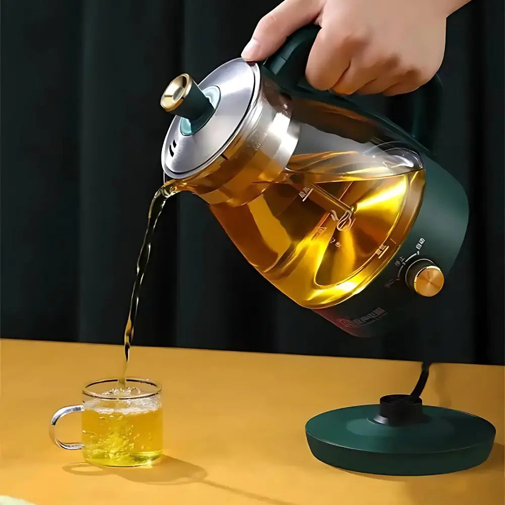 Japanese electric teapot with infuser sitting on a kitchen counter