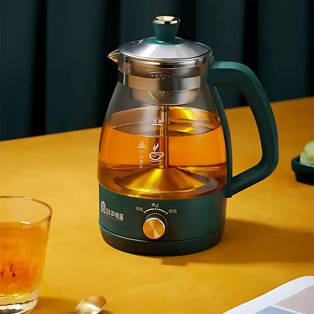 Glass electric teapot with stainless steel infuser basket and loose tea leaves