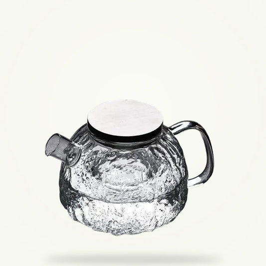 Japanese glass teapot 1.1L with stainless steel infuser on plain background
