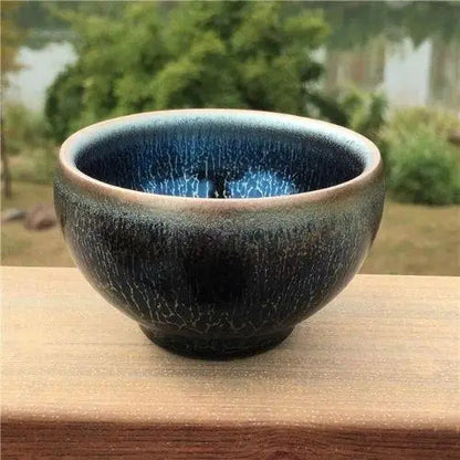Tenmoku matcha bowl glaze close-up showing crystalline surface fired at 1300°C