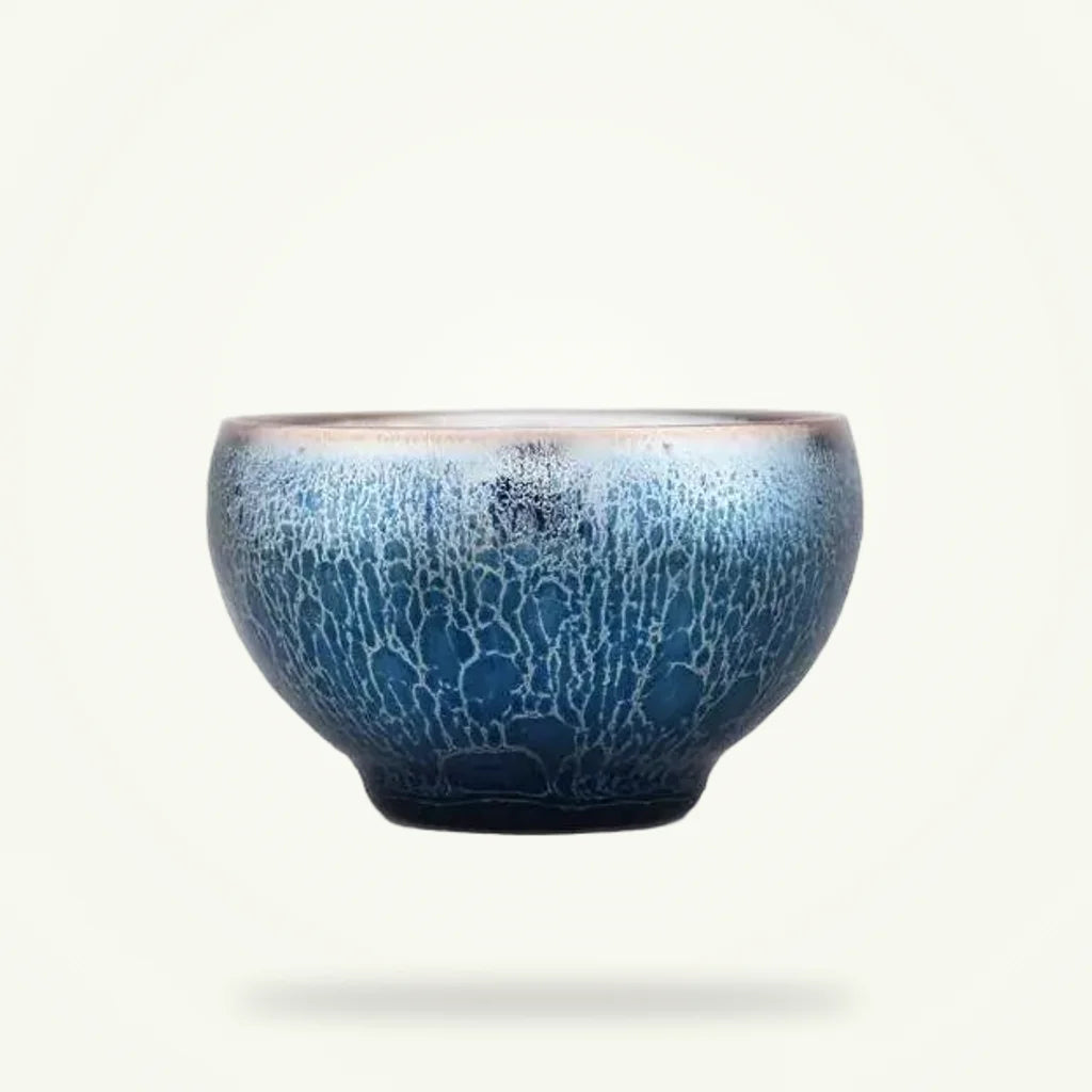 Handcrafted Tenmoku matcha bowl on plain background, dark iron-oxide glaze, 80 ml chawan