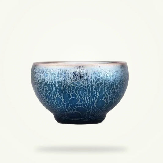 Handcrafted Tenmoku matcha bowl on plain background, dark iron-oxide glaze, 80 ml chawan