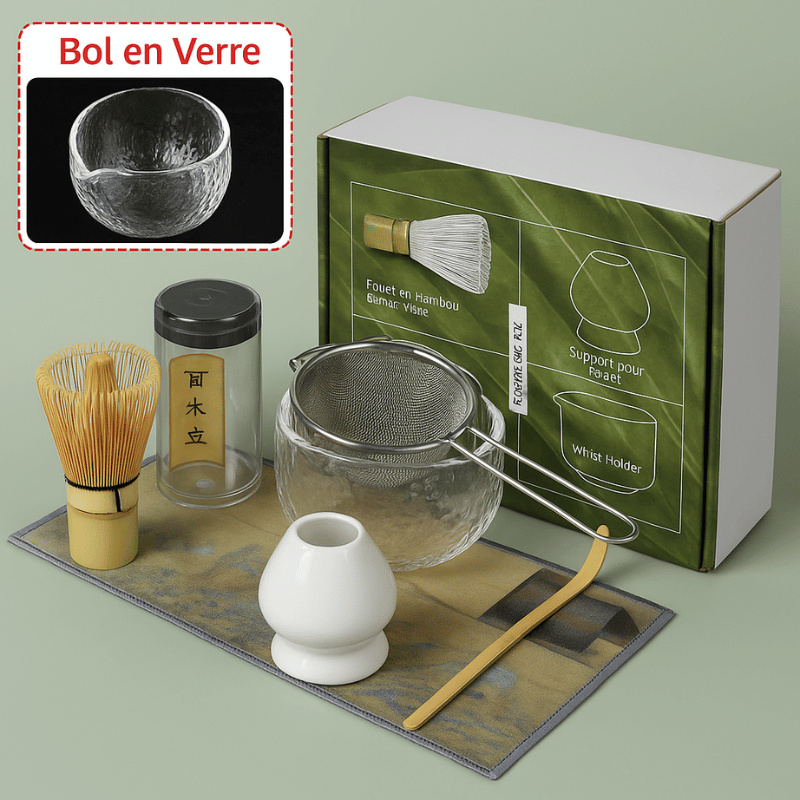Glass bowl and bamboo matcha tools arranged on natural wooden surface