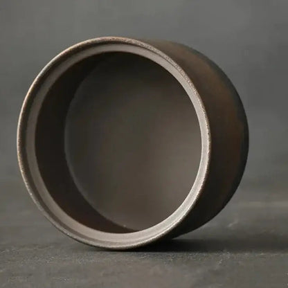 Beige sand ceramic tea canister with fitted lid top view