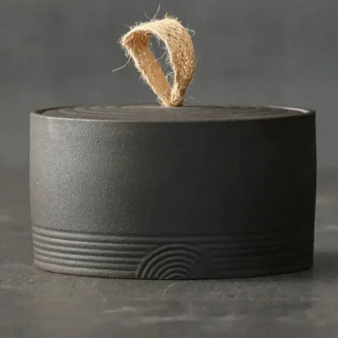 Matte black Japanese ceramic tea canister airtight lid side view