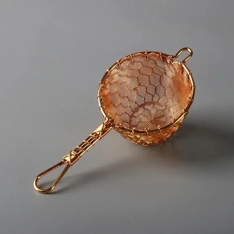 Copper tea strainer with loose leaf tea