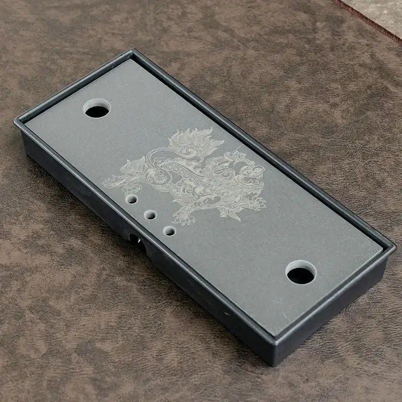 Japanese tea tray with teapot and cups on top