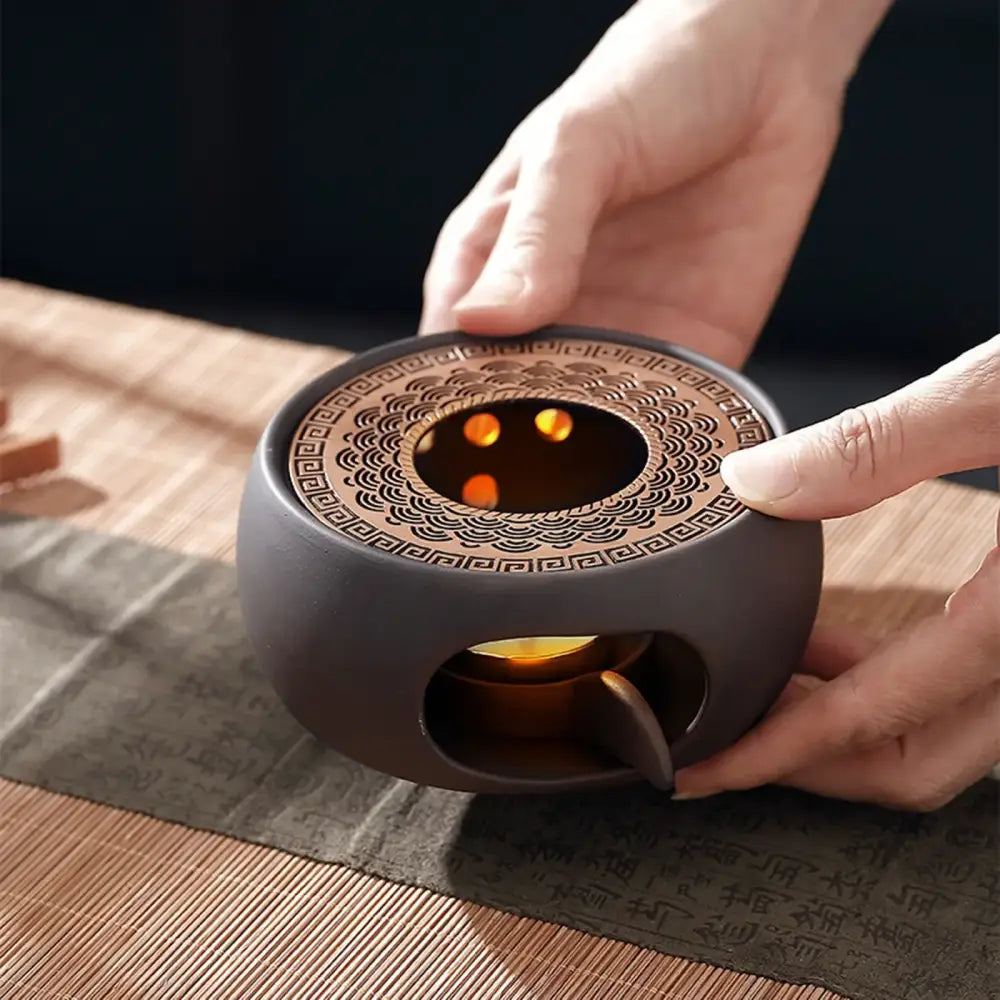 Top view of Japanese sculpted grid tea warmer showing open grid surface