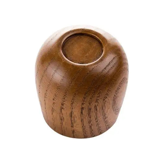 Bottom view of a wooden tea cup showing grain