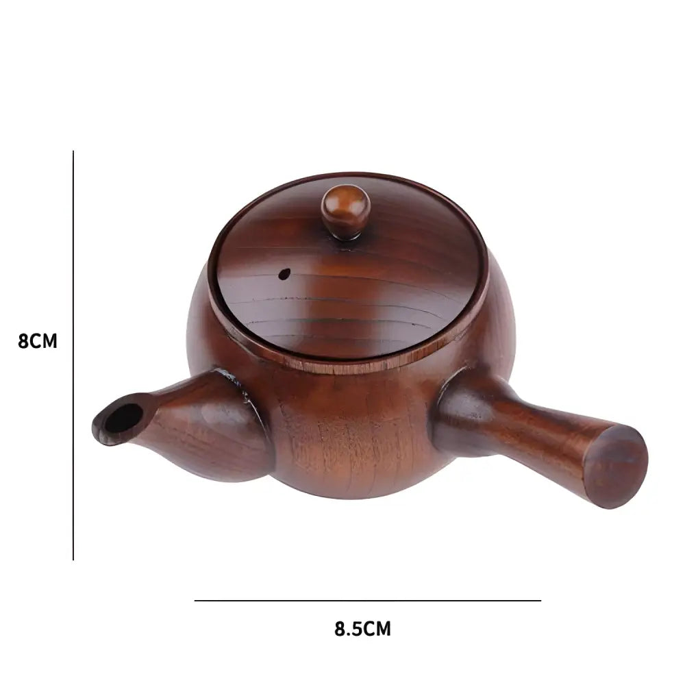 Size comparison of wood kyusu teapot next to tea cup