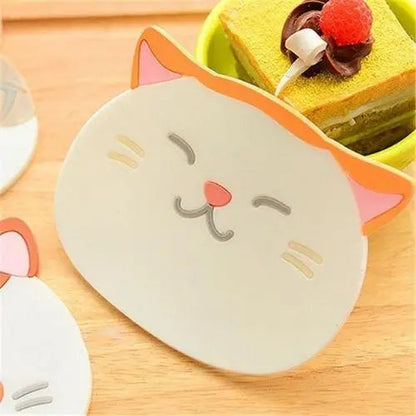 Using kawaii cat coaster under tea cup