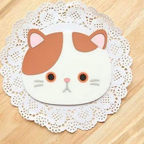 Brown kawaii cat coaster on table