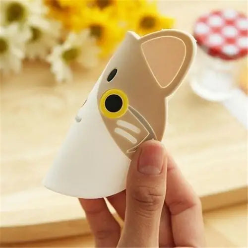 Flexible silicone cat coaster being bent