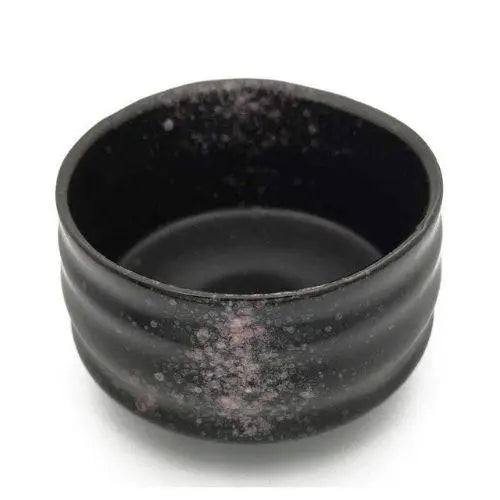 Black chawan bowl presentation with tea
