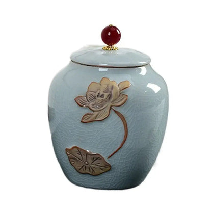 Sky blue ceramic tea jar open showing interior capacity for loose leaf tea