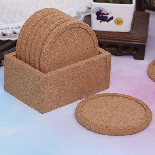 Set of five cork coasters arranged on table