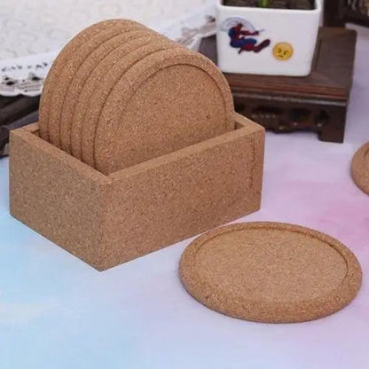 Set of five cork coasters arranged on table