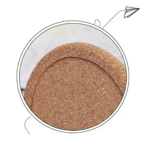 Cork coaster under a mug on wooden table