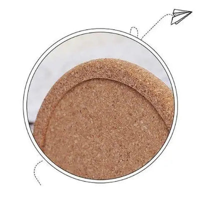 Cork coaster under a mug on wooden table