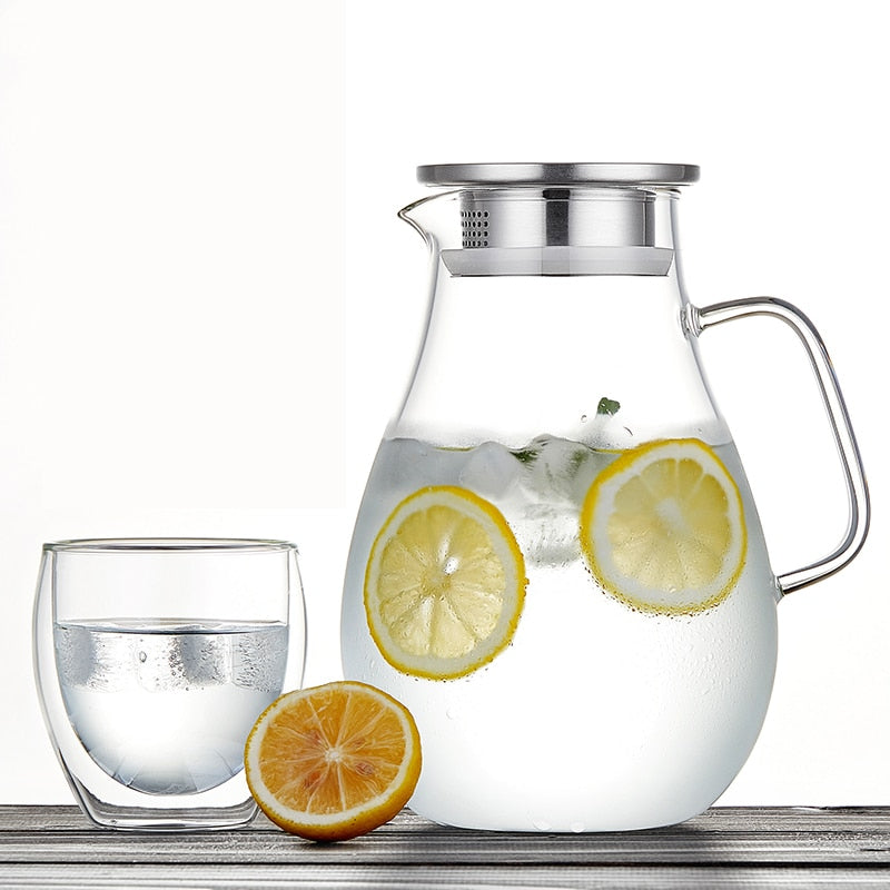 Borosilicate glass teapot with stainless steel lid and loose leaf tea inside
