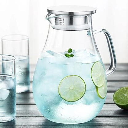 Loose leaf tea steeping in borosilicate glass teapot, leaves fully open
