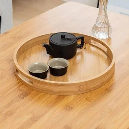Round bamboo tea tray presentation on table