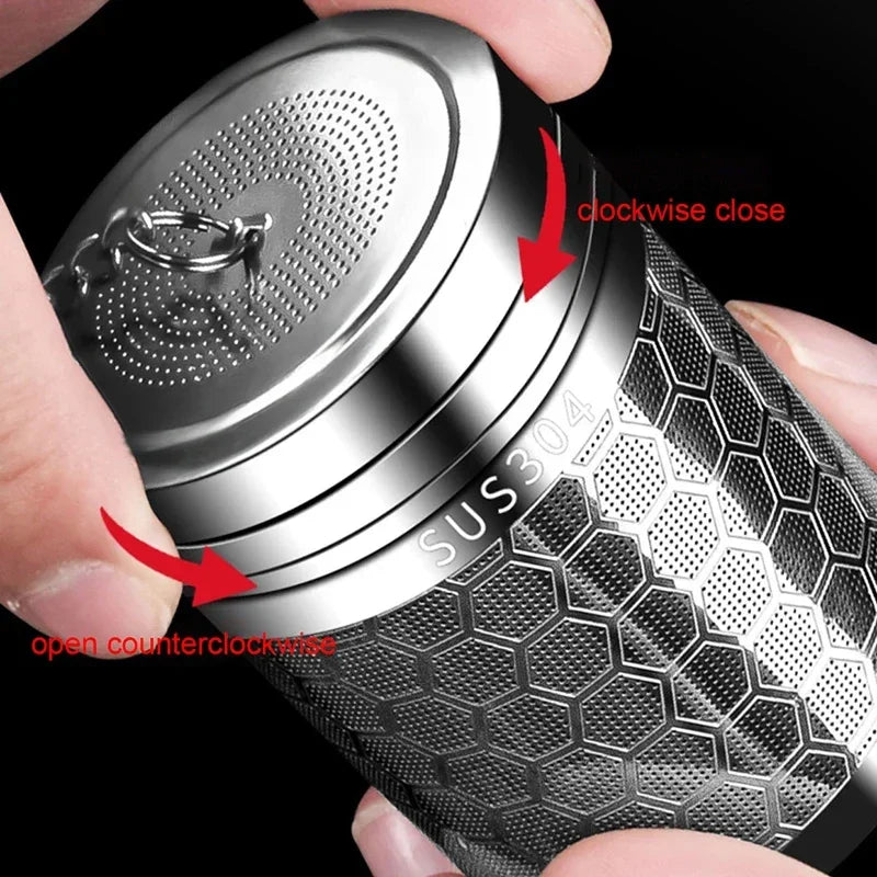 Stainless steel tea ball infuser resting inside a teapot
