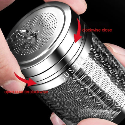 Stainless steel tea ball infuser resting inside a teapot